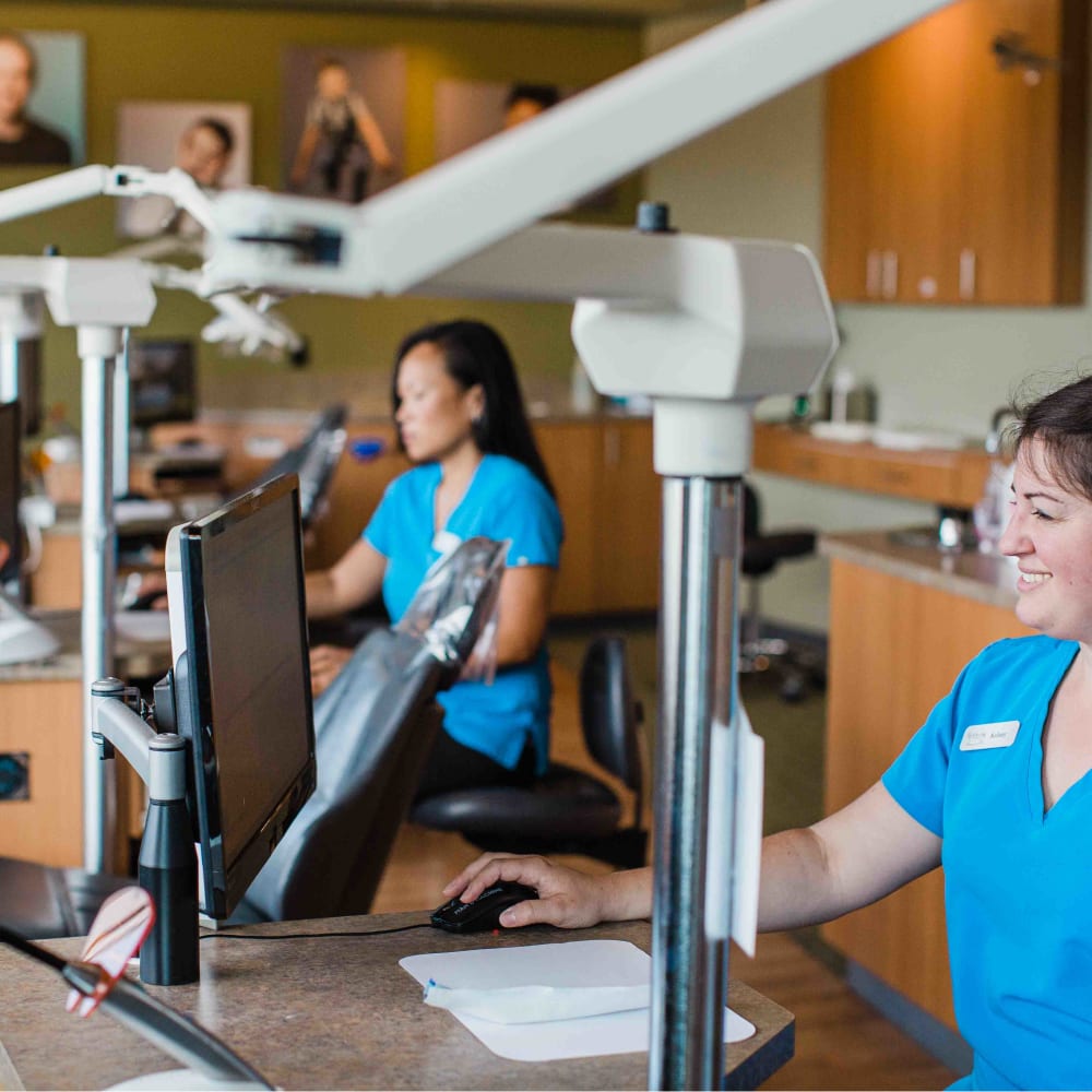 Two of our team using technology in the treatment room at North Seattle Orthodontics